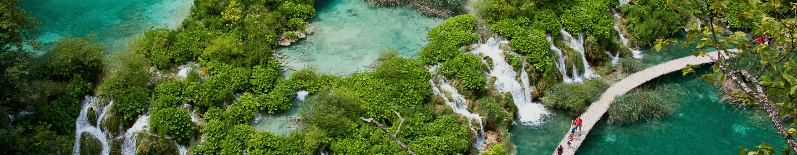Plitvice Lake National Park Boardwalk over turquoise waterfall in Croatia
